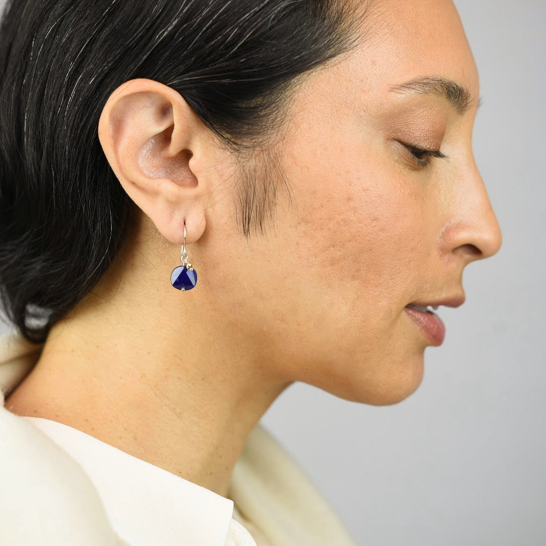 Close up image of a model wearing sterling silver Mix Metal Lapis Drop Earrings from Zurina Ketola