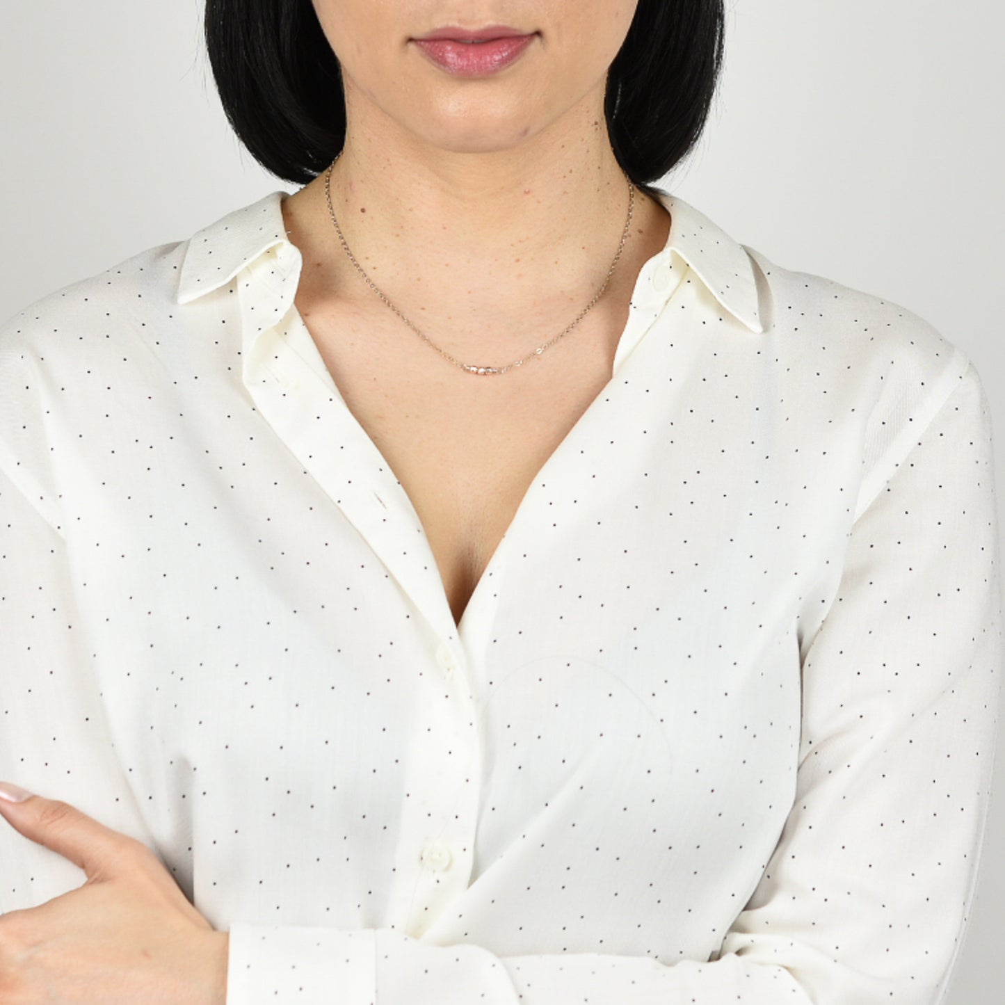 Model wearing mixed metal necklace.