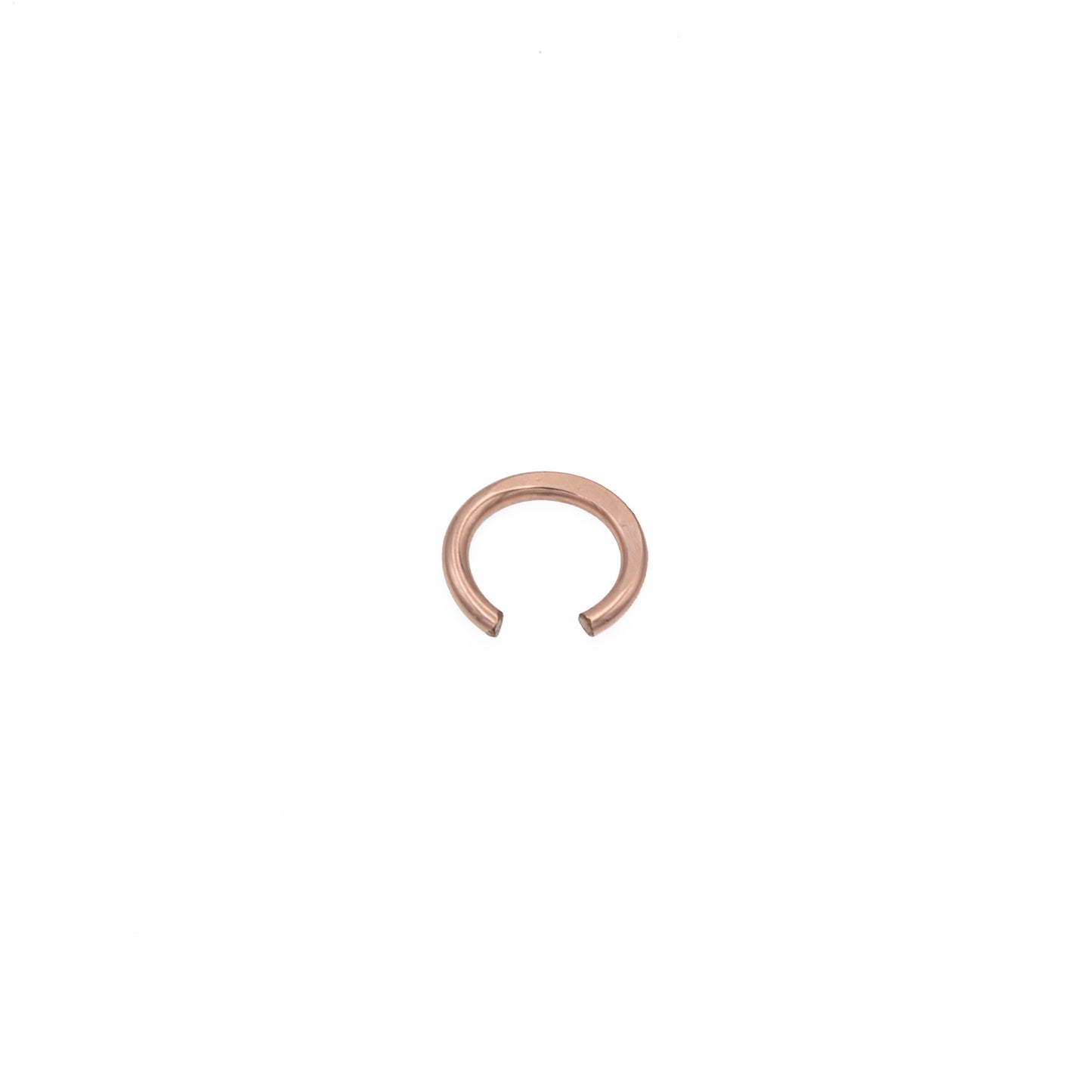 Zurina Ketola simple ear cuff in 14K rose gold fill, viewed from above at a slight angle, on white background.