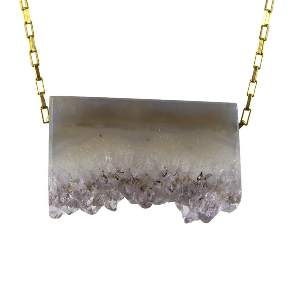 Zurina Ketola Designs Long Necklace featuring a one of a kind amethyst druzy slice pendant on 14K gold fill drawn cable chain on white background. Close up.