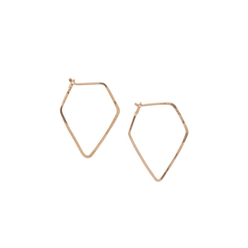 Zurina Ketola Designs handcrafted jewelry featuring handmade hoop earrings. Modern and minimal, these sleek diamond hoop earrings are made from 14K rose gold fill featuring ethically sourced gold.