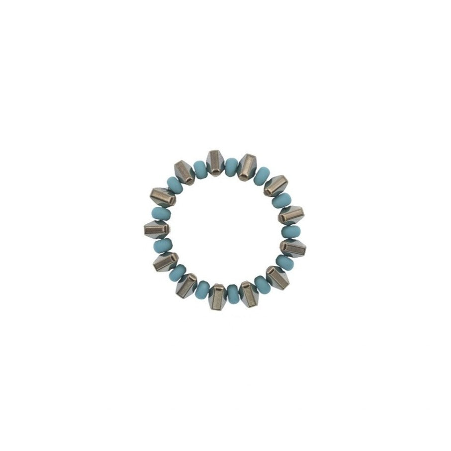 Zurina Ketola Beaded Pyrite Spike Ring in Turquoise on White Background.