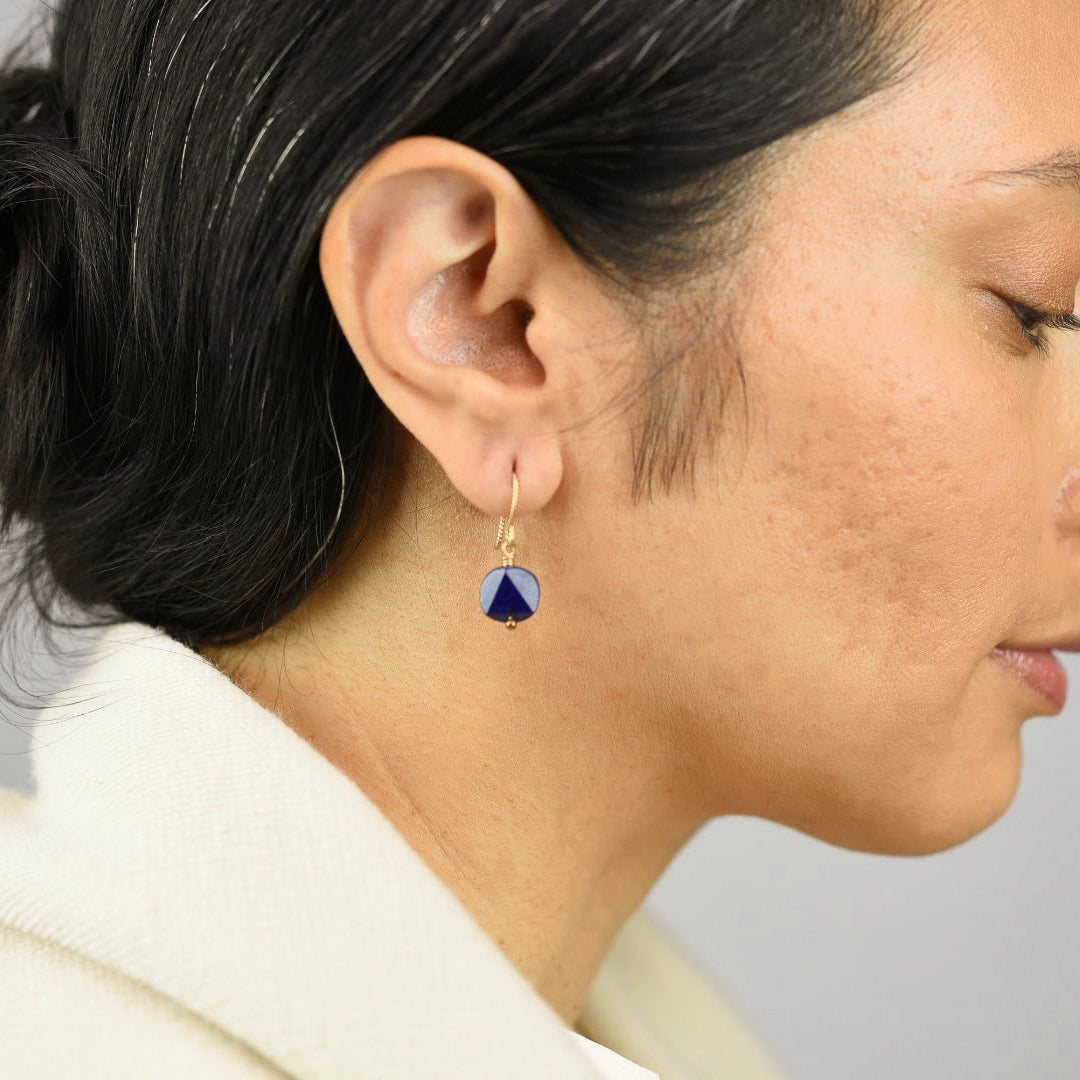  Close up image of a model wearing 14K gold fill Geometric Lapis Drop Earrings from Zurina Ketola