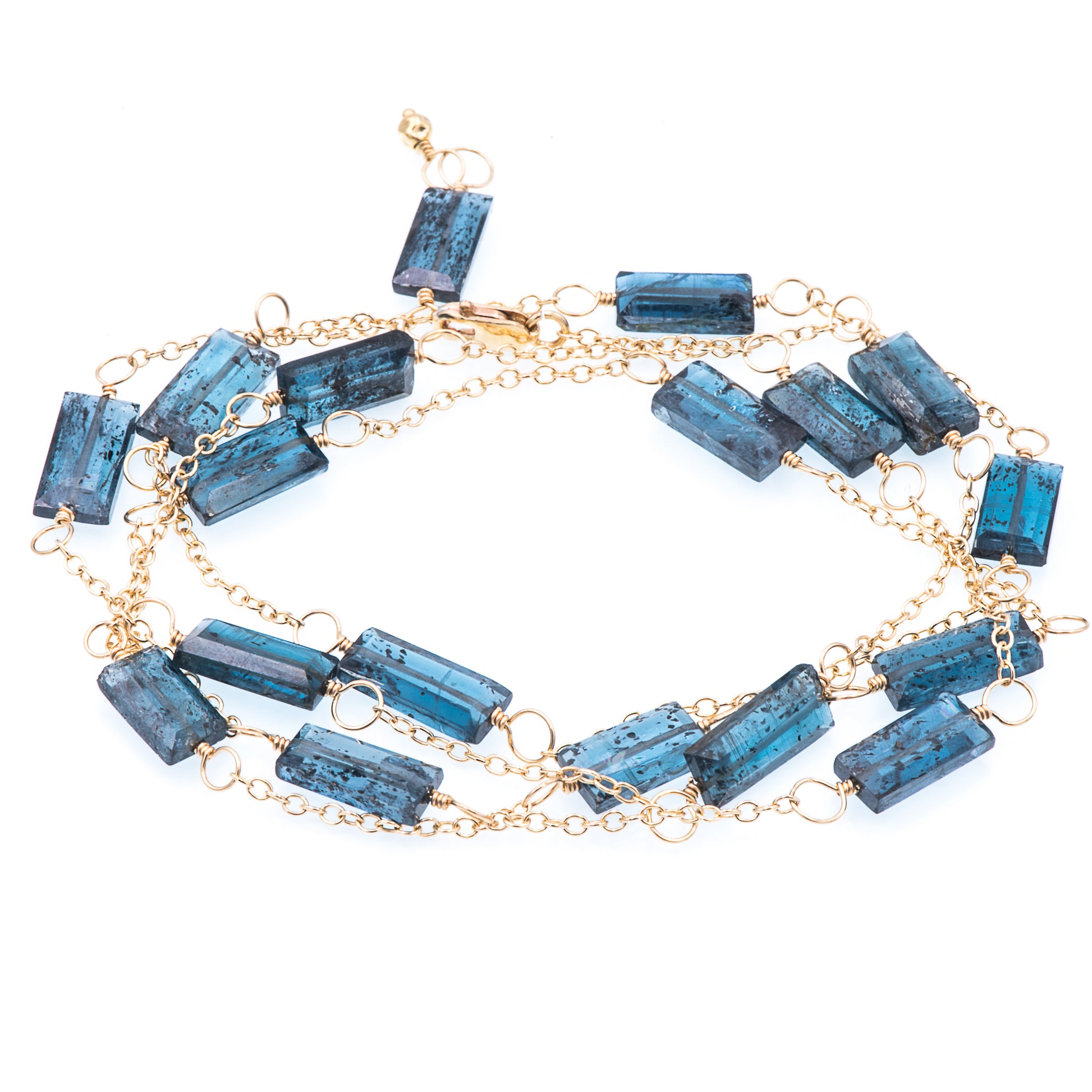 Zurina Ketola long moss aquamarine necklace in 14K gold fill shown as a wrap bracelet on white background.