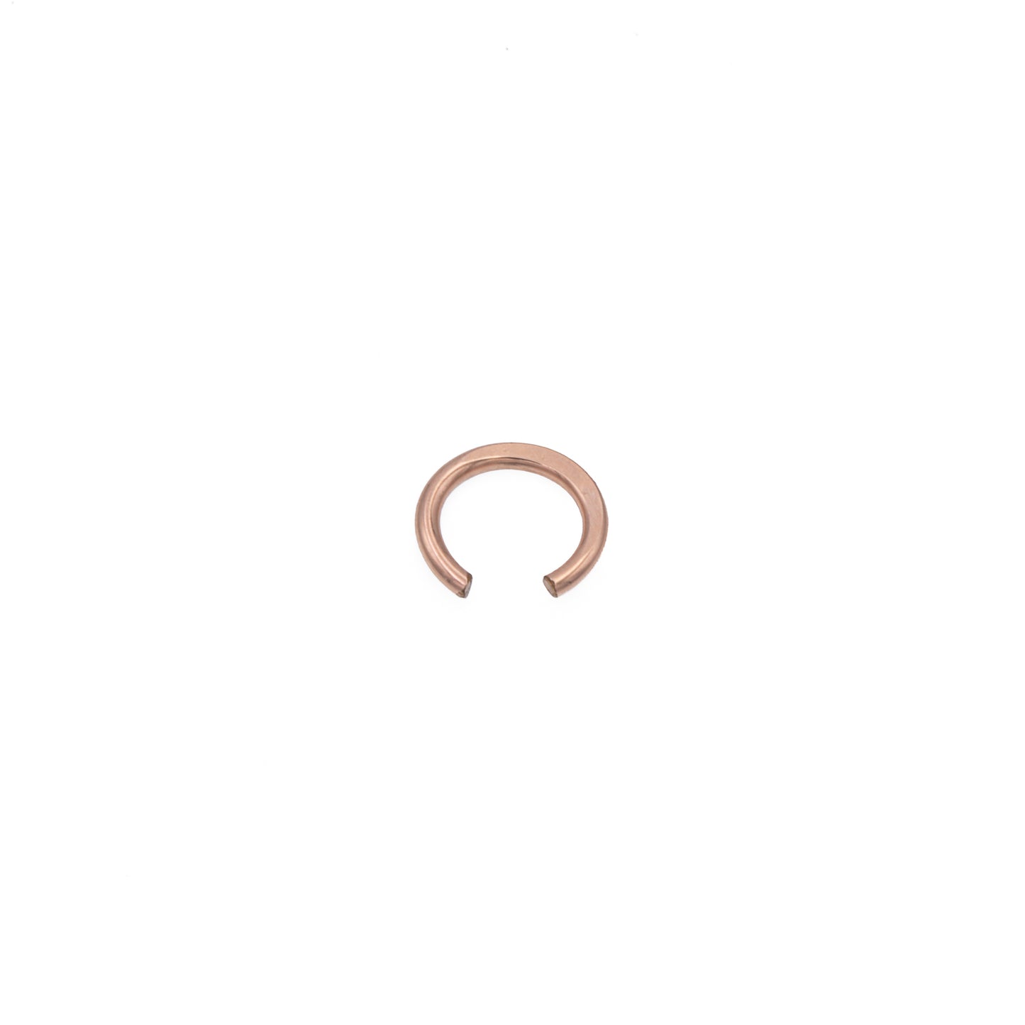 Zurina Ketola simple ear cuff in 14K rose  gold fill, viewed from above at a slight angle, on white background.