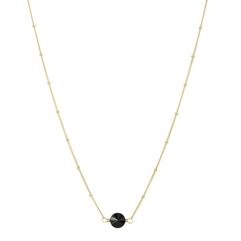 Zurina Ketola Designs black agate pinwheel necklace in 14K gold fill on white background