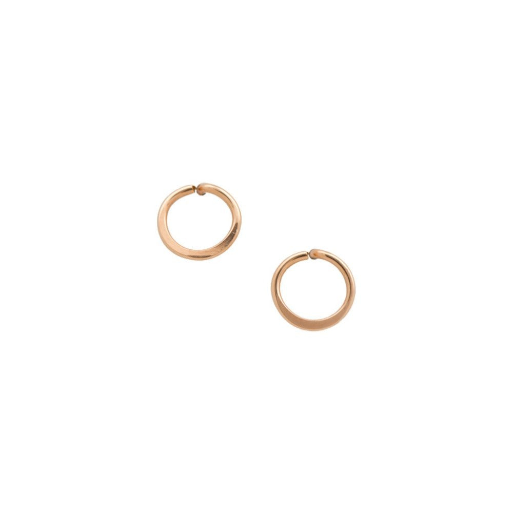 Zurina Ketola handmade circle post earrings in 14K rose gold fill on white background. Made from ethically sourced gold.