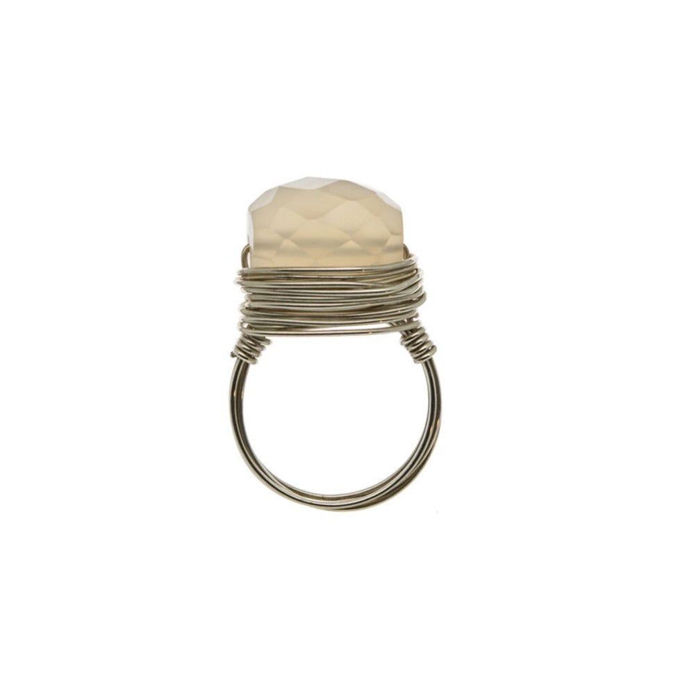Zurina Ketola Design wire wrapped pink halcedony ring in sterling silver on white background.