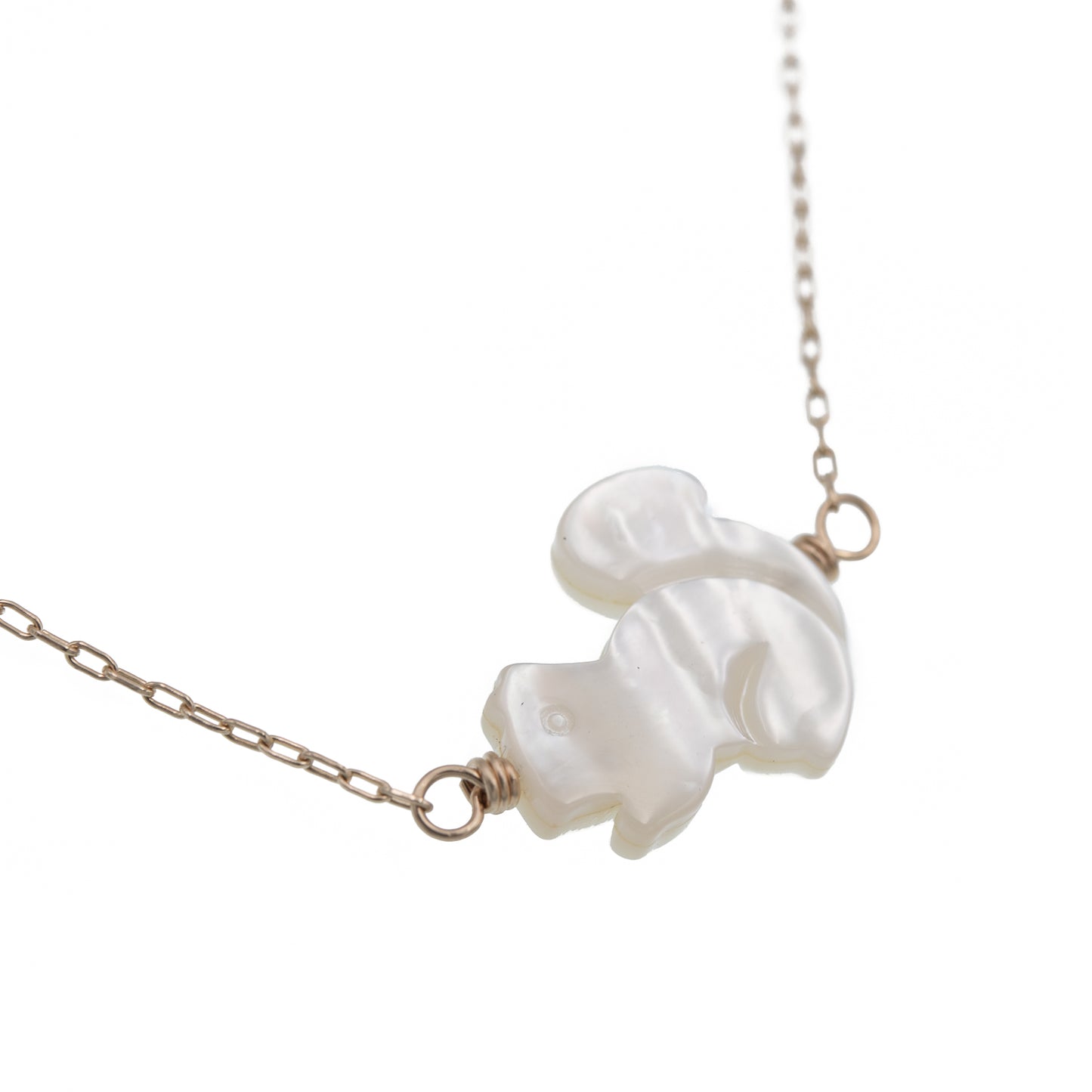 Zurina Ketola Designs carved mother of pearl squirrel necklace in 14K gold fill. Close Up.